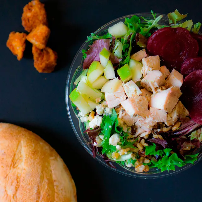 Aerial View of a Bread Zeppelin Salad: A captivating cenital shot of a colorful Bread Zeppelin salad, featuring fresh greens, vibrant vegetables, and artisanal toppings, beautifully arranged in a bowl for an appetizing presentation.